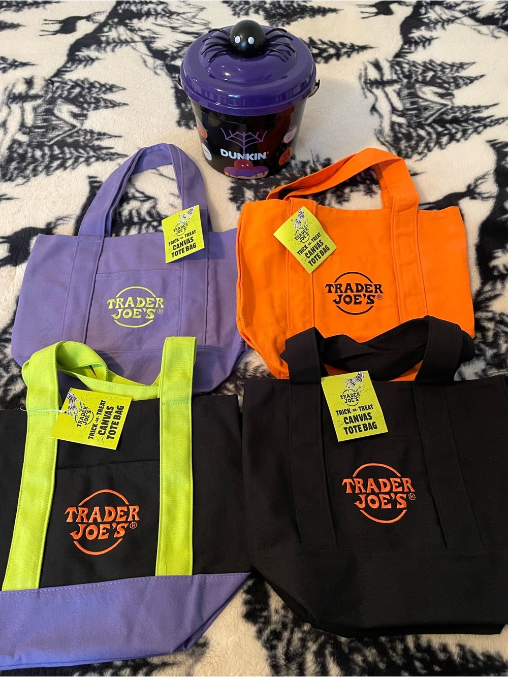 Halloween mini tote bags with a 2025 Dunkin bucket.